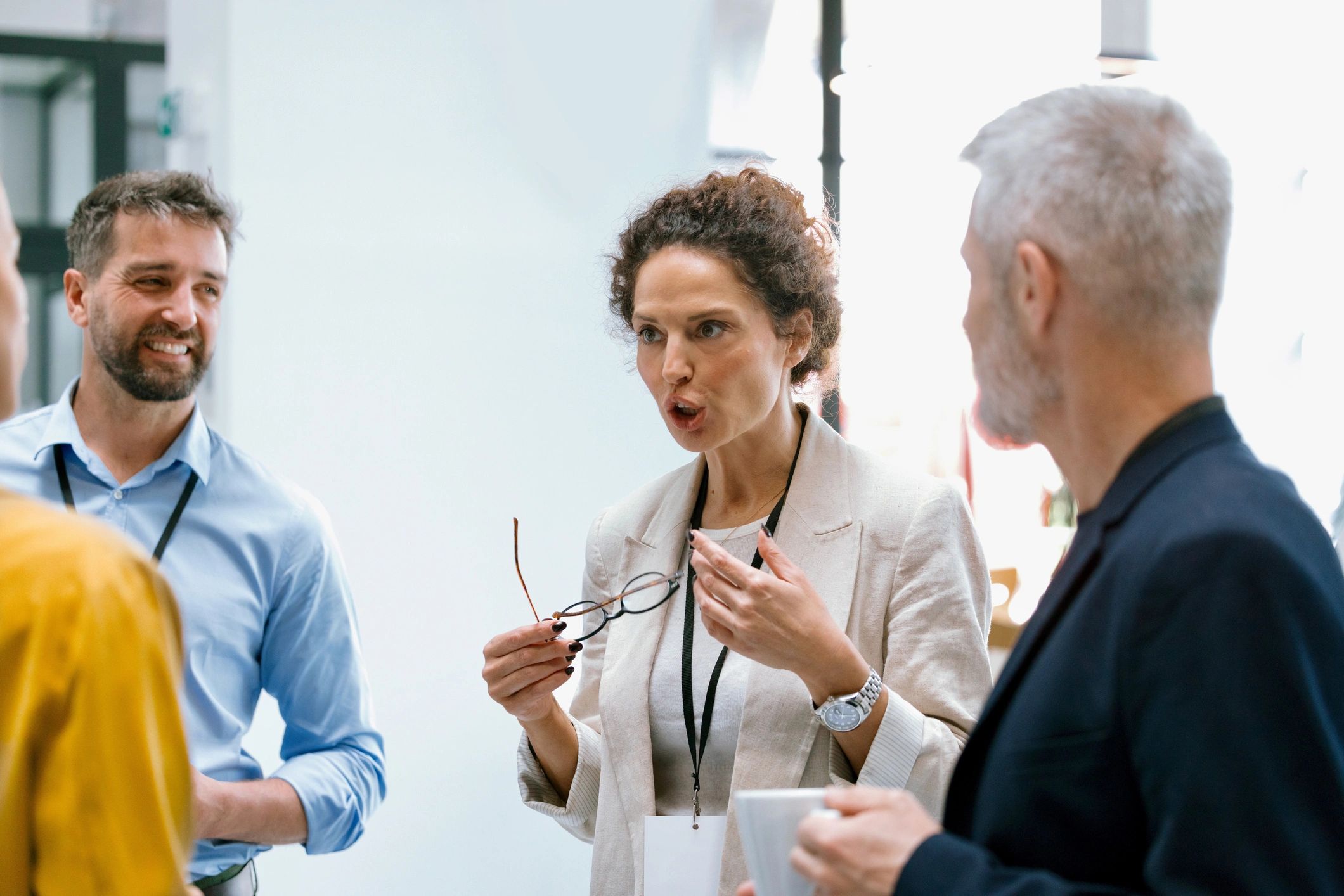 Business professionals connecting during a conference break